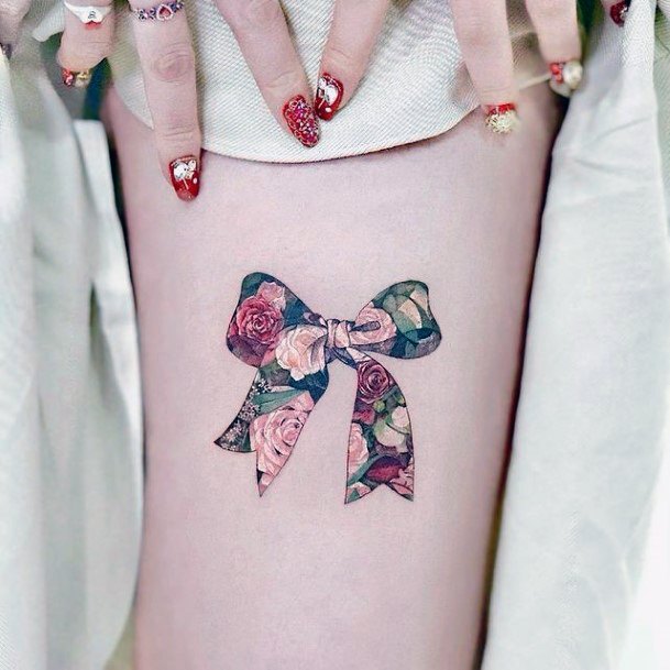 Female Bow Tattoo On Woman