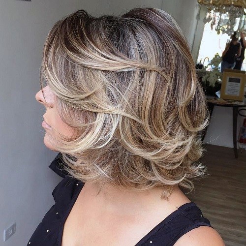 Female Chin Length Airy Sandy Blonde Hair And Multiple Layers