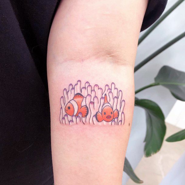 Female Cool Clown Fish Tattoo Design