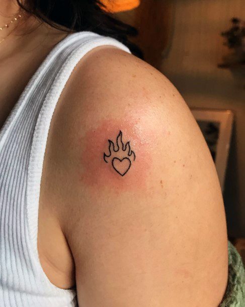 Female Cool Flaming Heart Tattoo Ideas