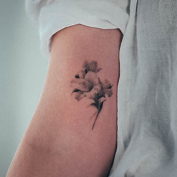 Female Cool Lily Tattoo Design