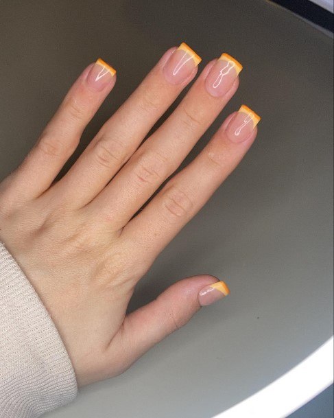 Female Cool Orange French Tip Nail Ideas