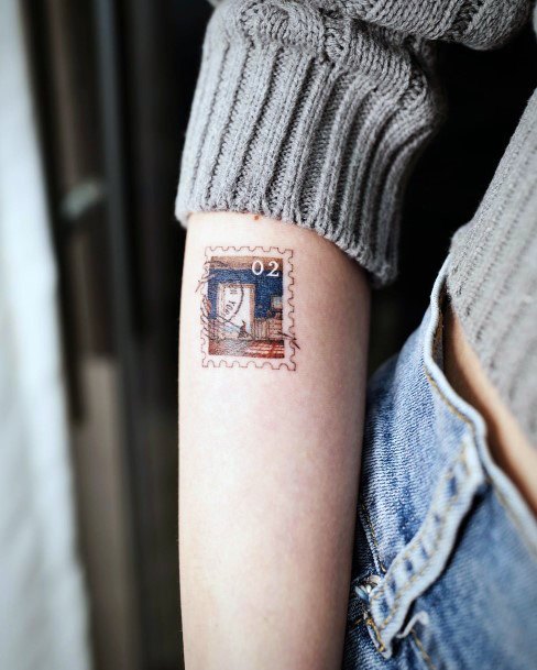 Female Cool Postage Stamp Tattoo Ideas