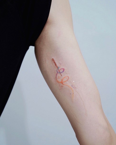 Female Cool Wand Tattoo Design