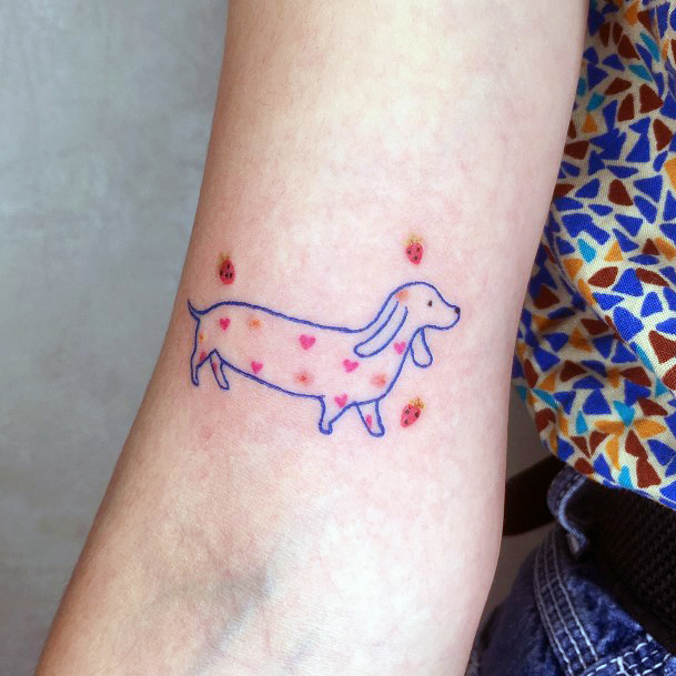 Female Dachshund Tattoo On Woman