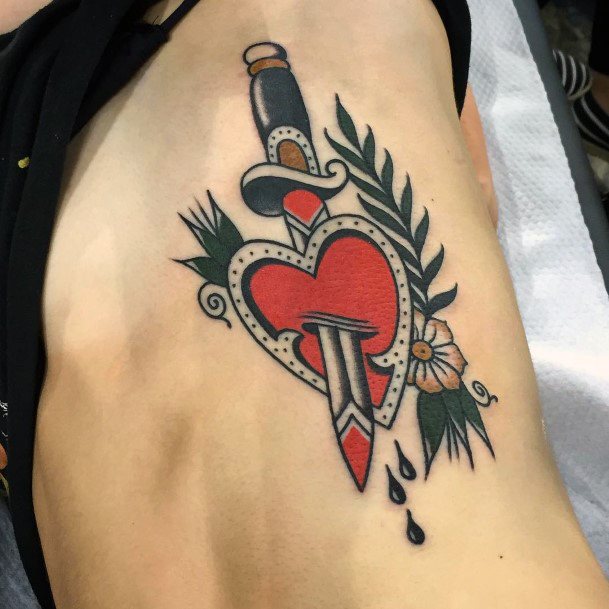 Female Dagger Heart Tattoo On Woman