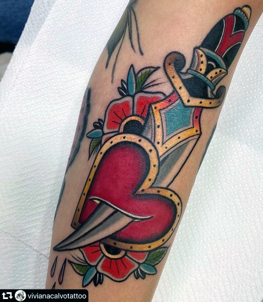 Female Dagger Heart Tattoos