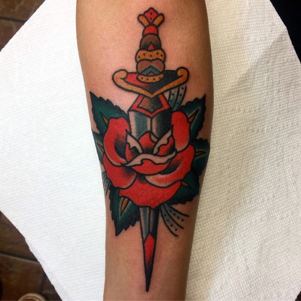 Female Dagger Rose Tattoo On Woman