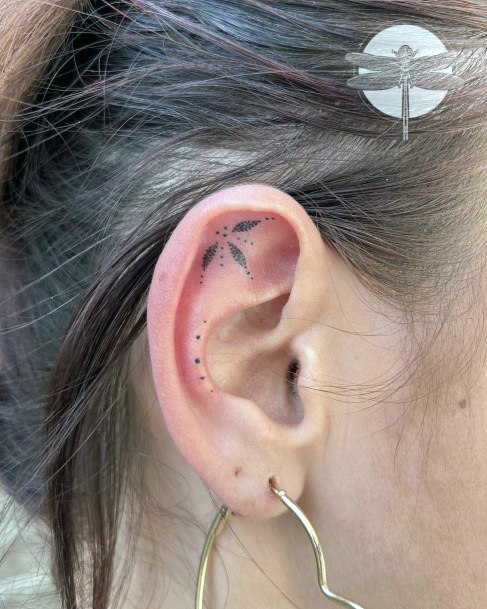 Female Ear Tattoo On Woman