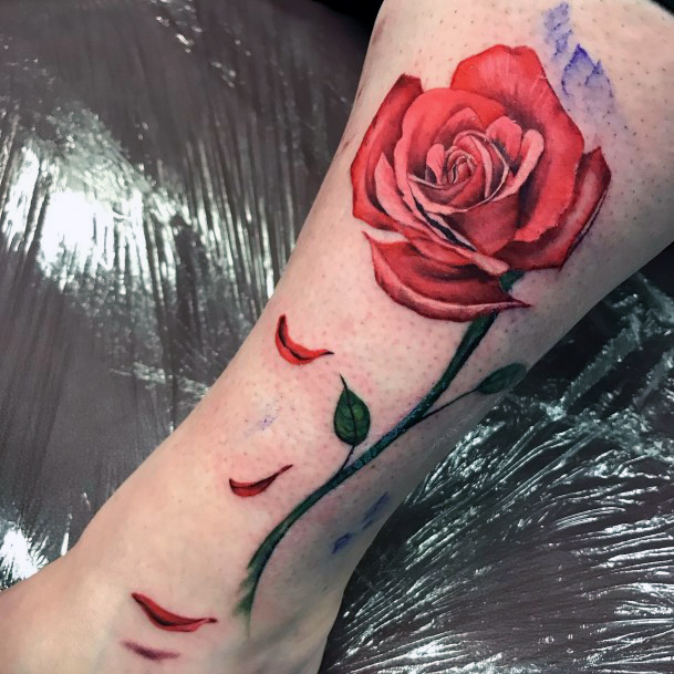 Female Enchanted Rose Tattoo On Woman