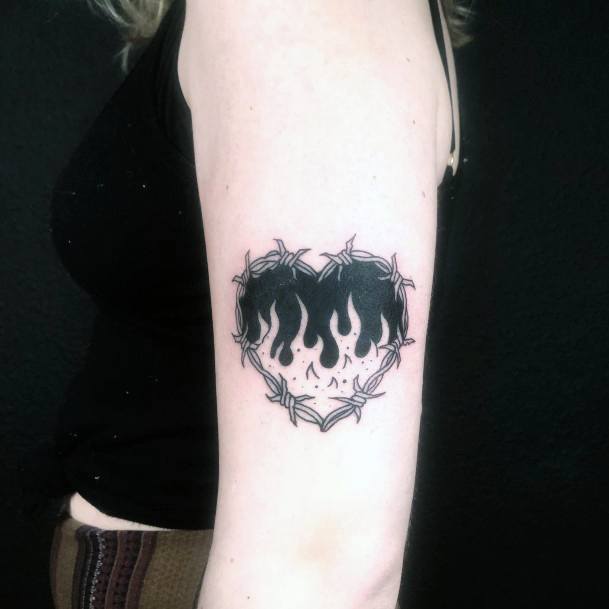 Female Flaming Heart Tattoo On Woman