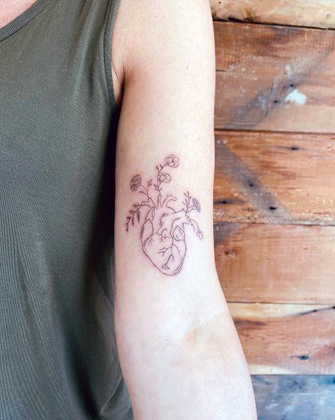 Female Flower Heart Tattoo On Woman