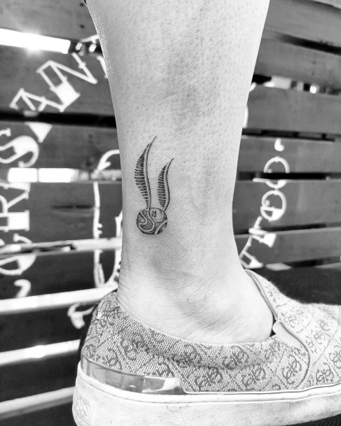 Female Golden Snitch Tattoo On Woman