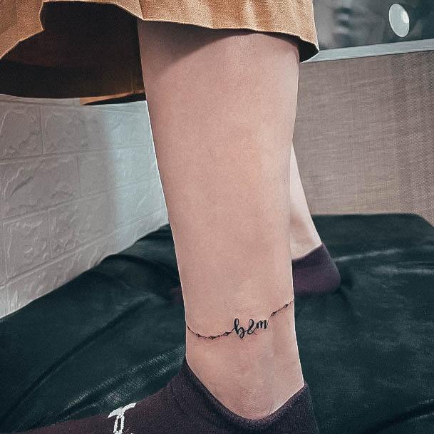 Female Initials Tattoo On Woman