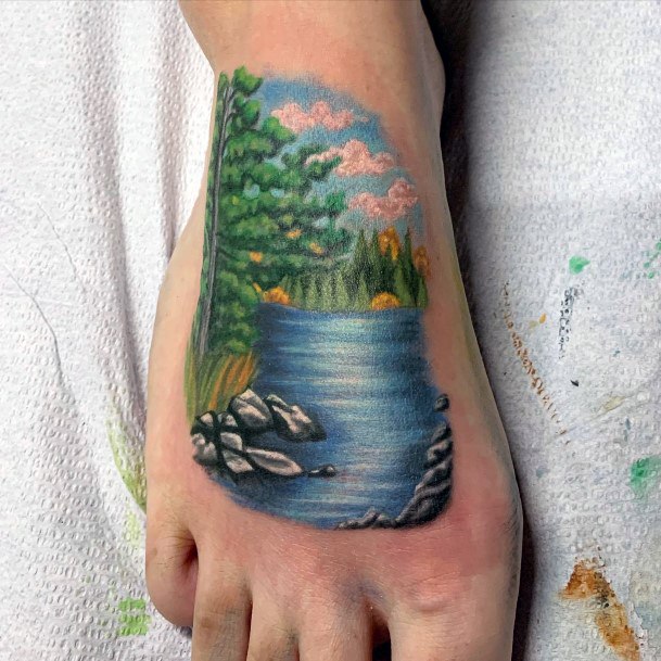 Female Lake Tattoo On Woman