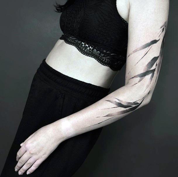 Female Leaf Tattoo On Woman