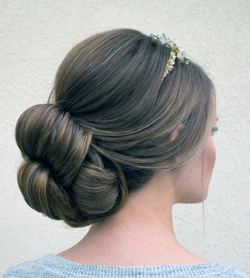 Female Light Brown Hair Into Thick Bun And Wedding Headpiece