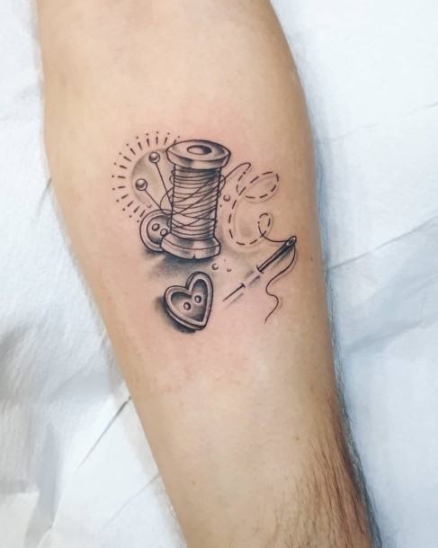 Female Needle And Thread Tattoo On Woman