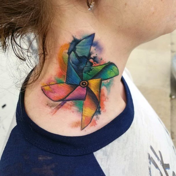 Female Pin Wheel Tattoo On Woman