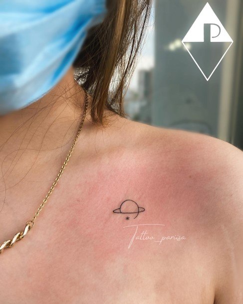 Female Saturn Tattoo On Woman