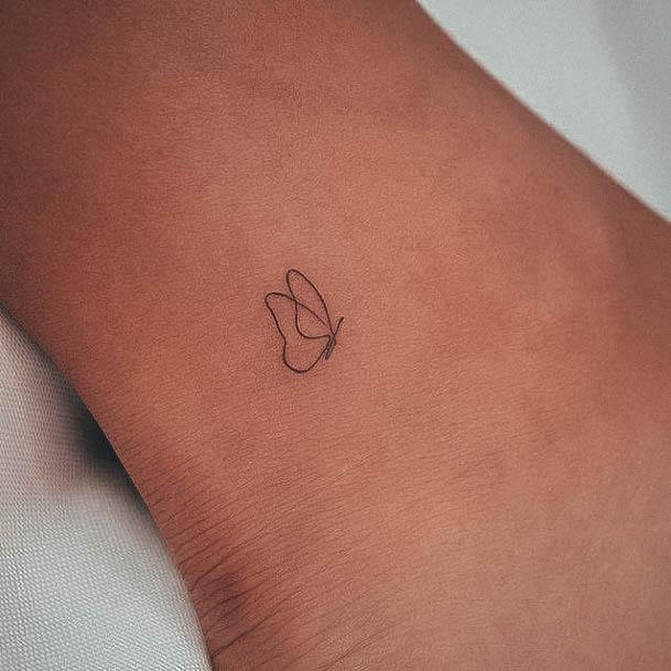 Female Small Meaningful Tattoo On Woman