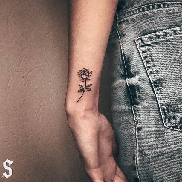 Female Small Rose Tattoo On Woman