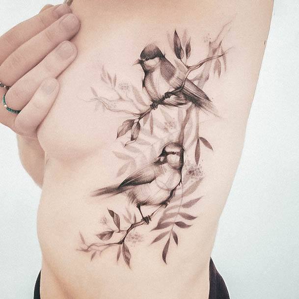 Female Small Sparrow Tattoo On Woman