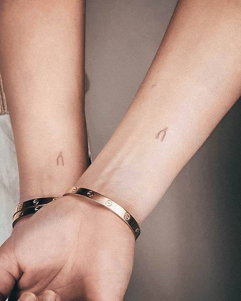 Female Small Wrist Tattoo On Woman