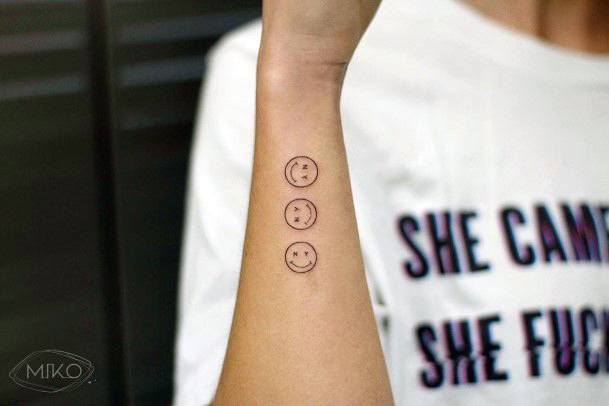 Female Smiley Face Tattoo On Woman
