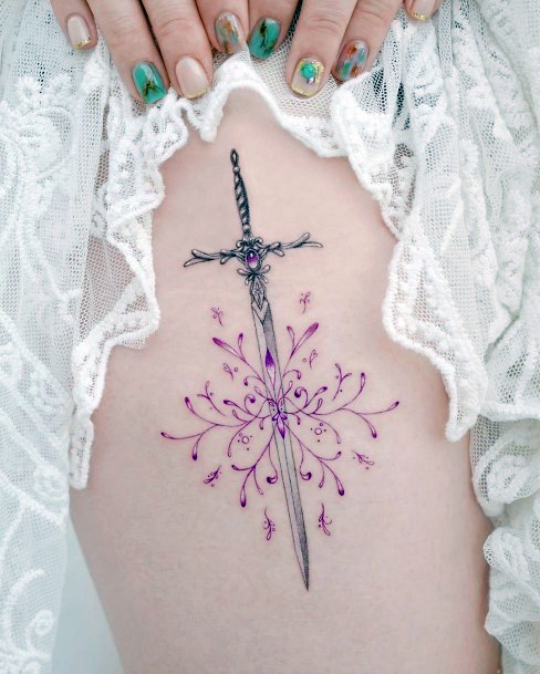 Female Sword Tattoo On Woman