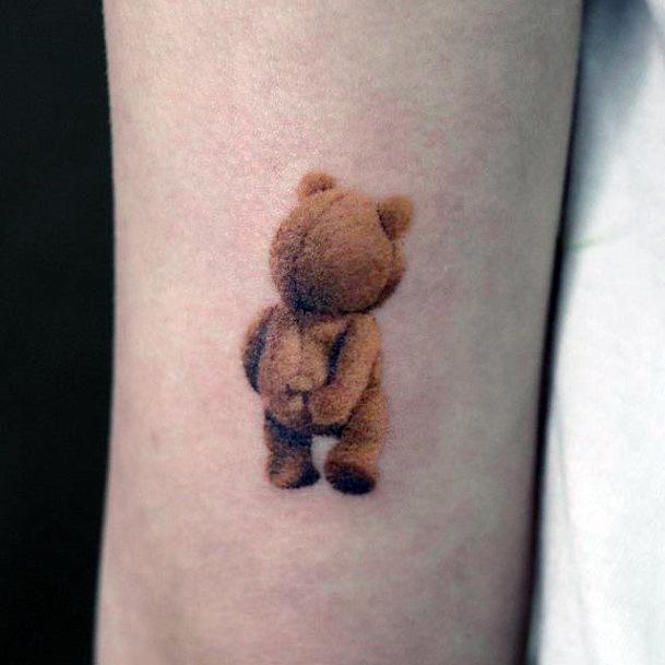 Female Teddy Bear Tattoo On Woman