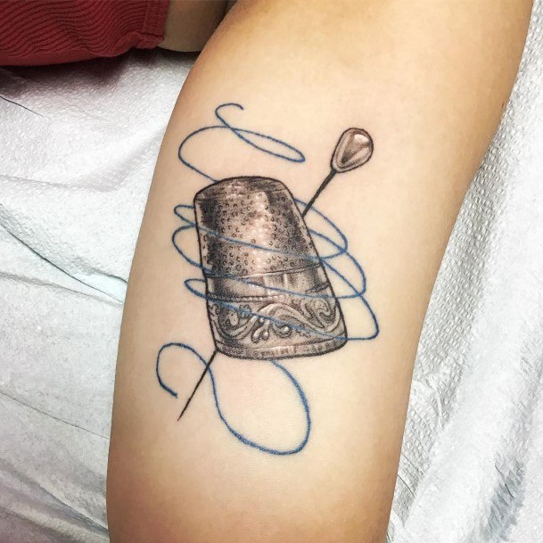 Female Thimble Tattoo On Woman