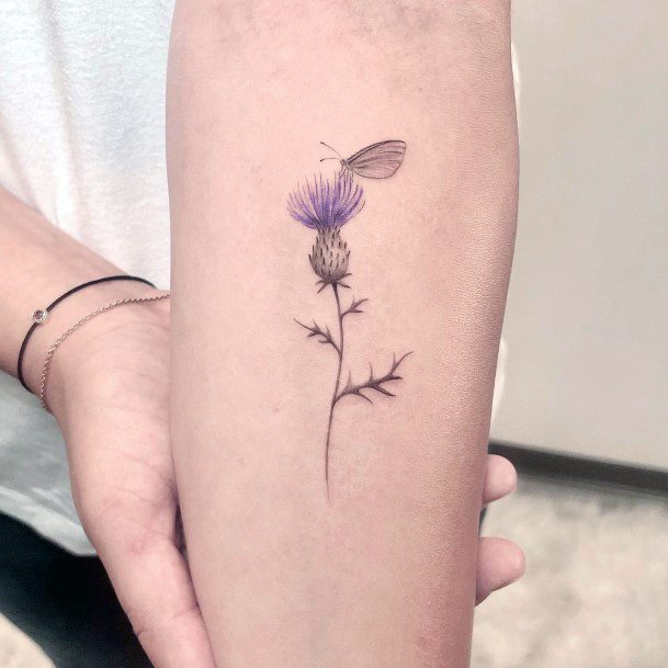 Female Thistle Tattoo On Woman