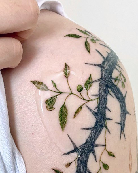 Female Thorns Tattoo On Woman