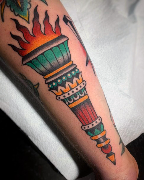 Female Torch Tattoo On Woman