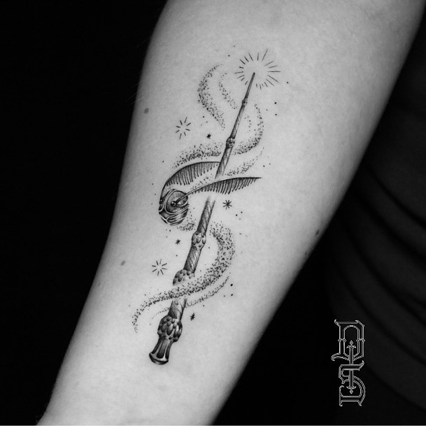 Female Wand Tattoo On Woman