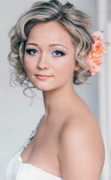 Female Wedding Style With Curls And Floral Headpiece