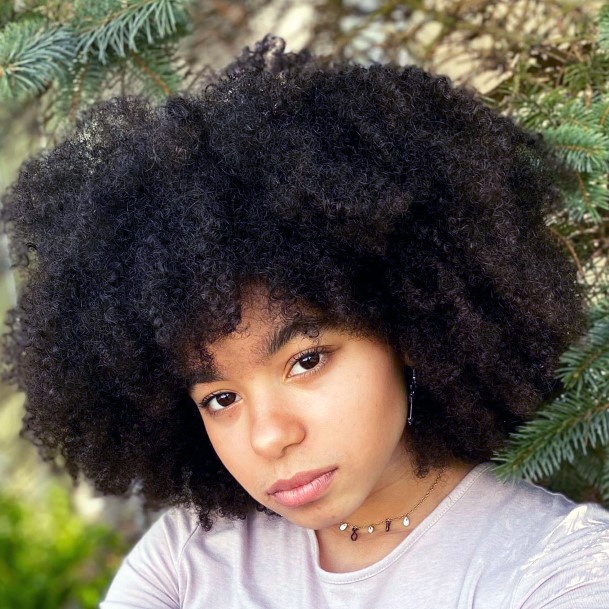 Female With Natural Texture Afro And Style With Attitude And Confidence