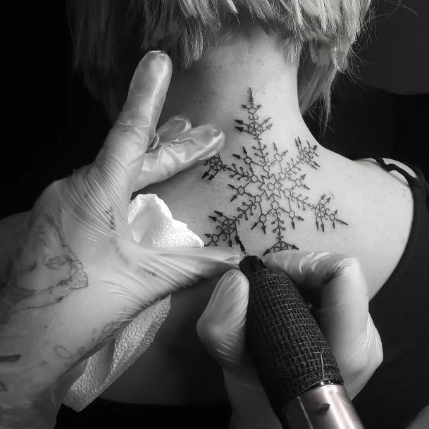 Female With Snowflake Tattoo