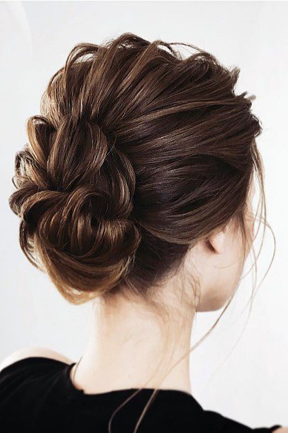 Female With Updo Large Curl Bun In Chestnut Brown Hair