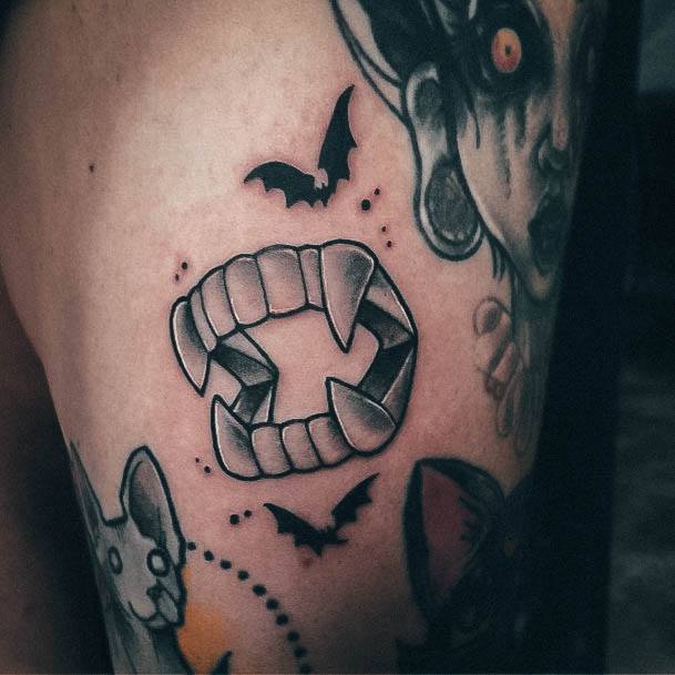 Females Fangs Tattoos