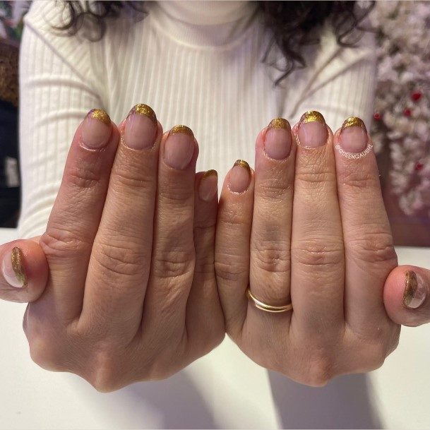 Females Gold French Tip Nails