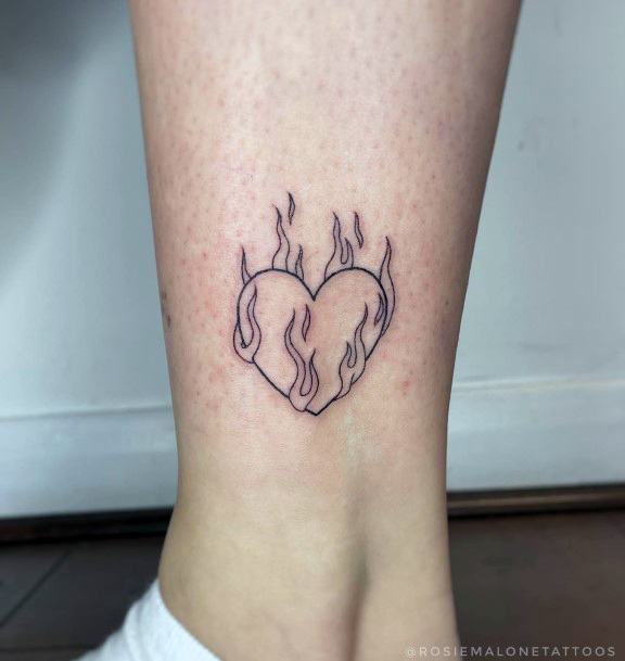 Feminine Flaming Heart Tattoo Designs For Women