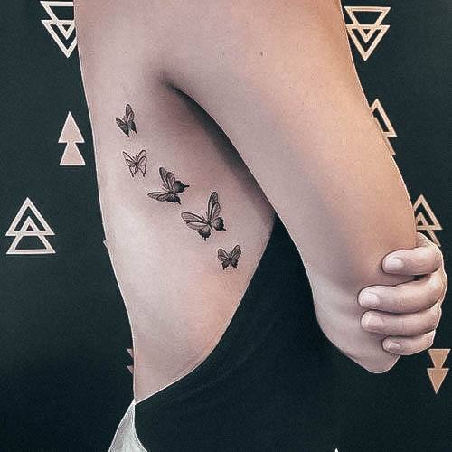 Feminine Rib Tattoo Designs For Women Tiny Butterflies