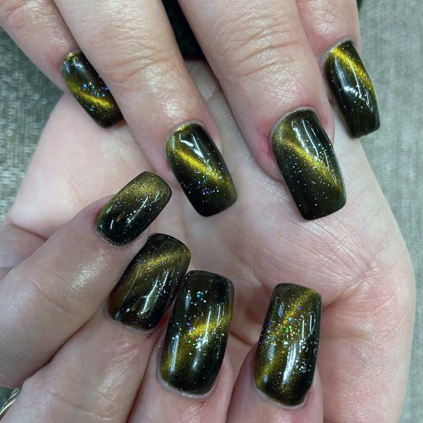 Flashy Gold On Black Nail Design