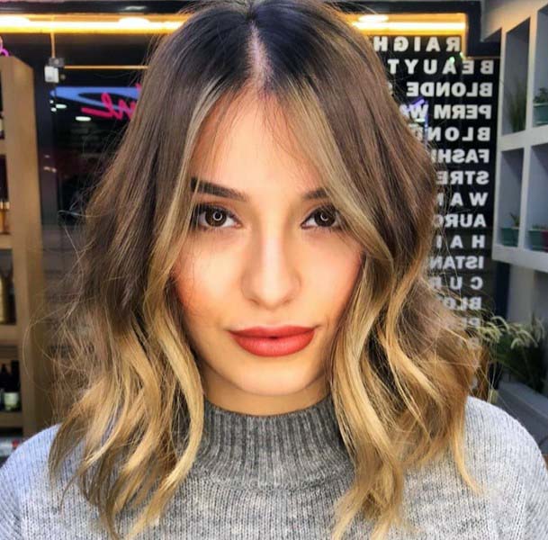 Flattering And Unique Womens Mid Length Hair Look With Highlights