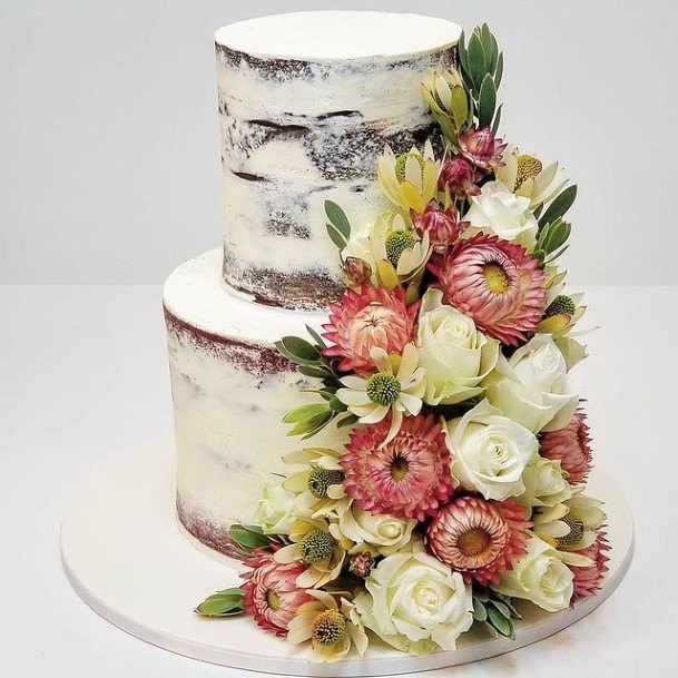 Flower Bouquet On Country Wedding Cake