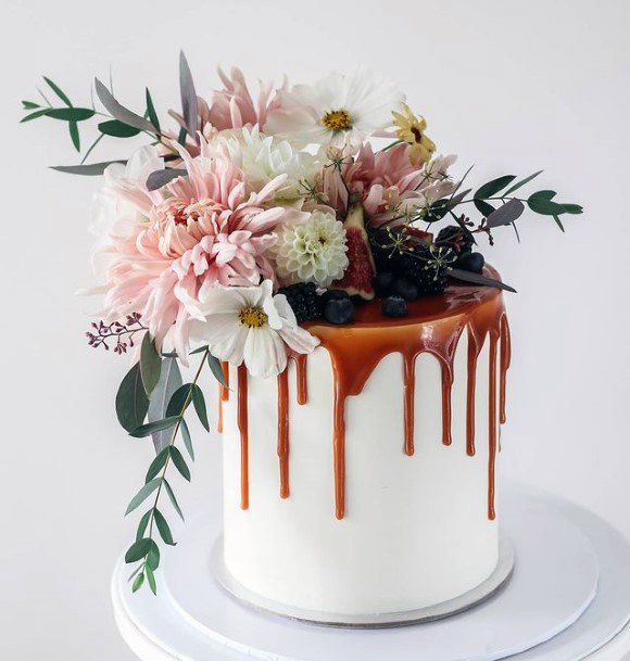 Flowing Caramel And Realistic Floral Rustic Wedding Cake