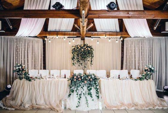 Flowy White Linen Wedding Head Table Decor