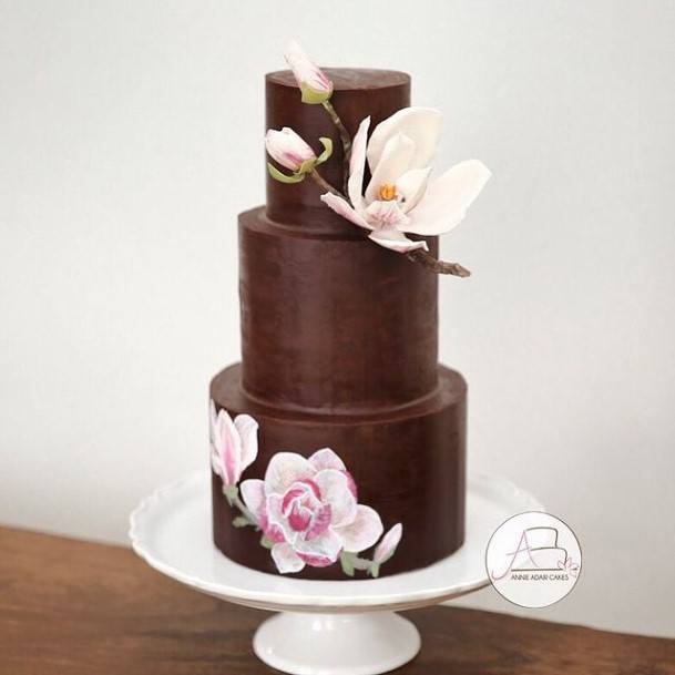 Fluttering Flowers On Chocolate Wedding Cake